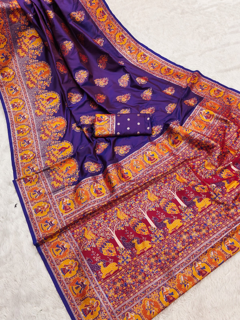 Colorful traditional fabric with intricate patterns on a light gray background