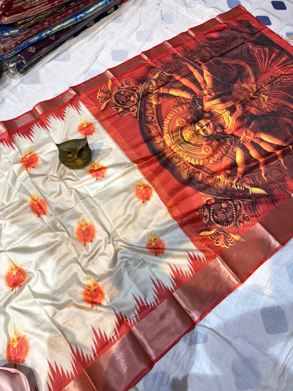 Saree with Maa Durga design on a white and red background