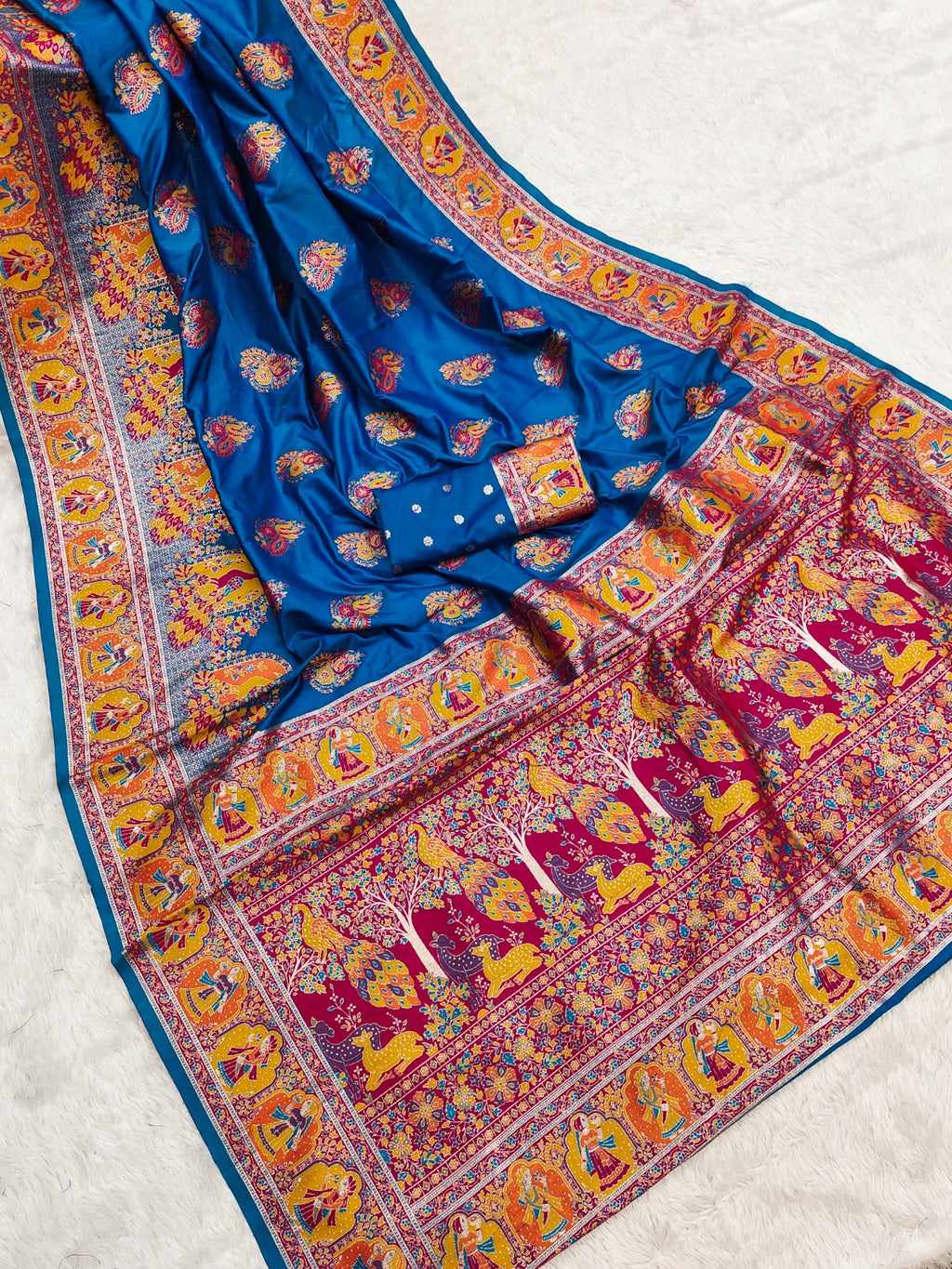 Colorful traditional fabric with intricate patterns on a light background